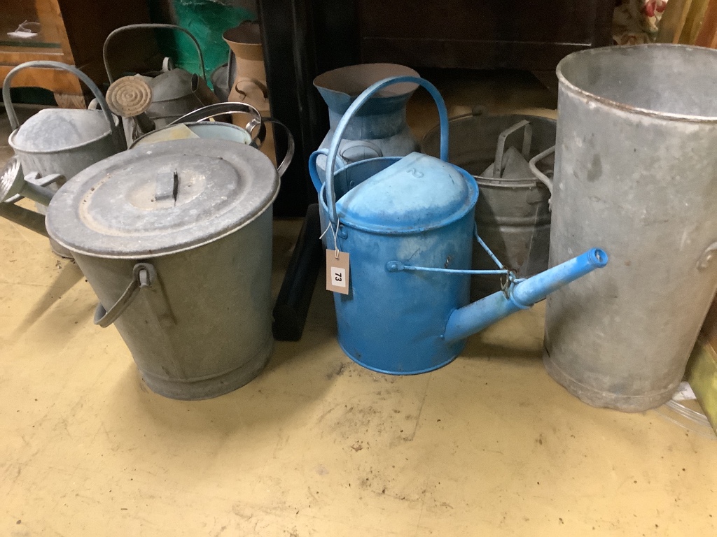 A quantity of assorted galvanised buckets and watering cans